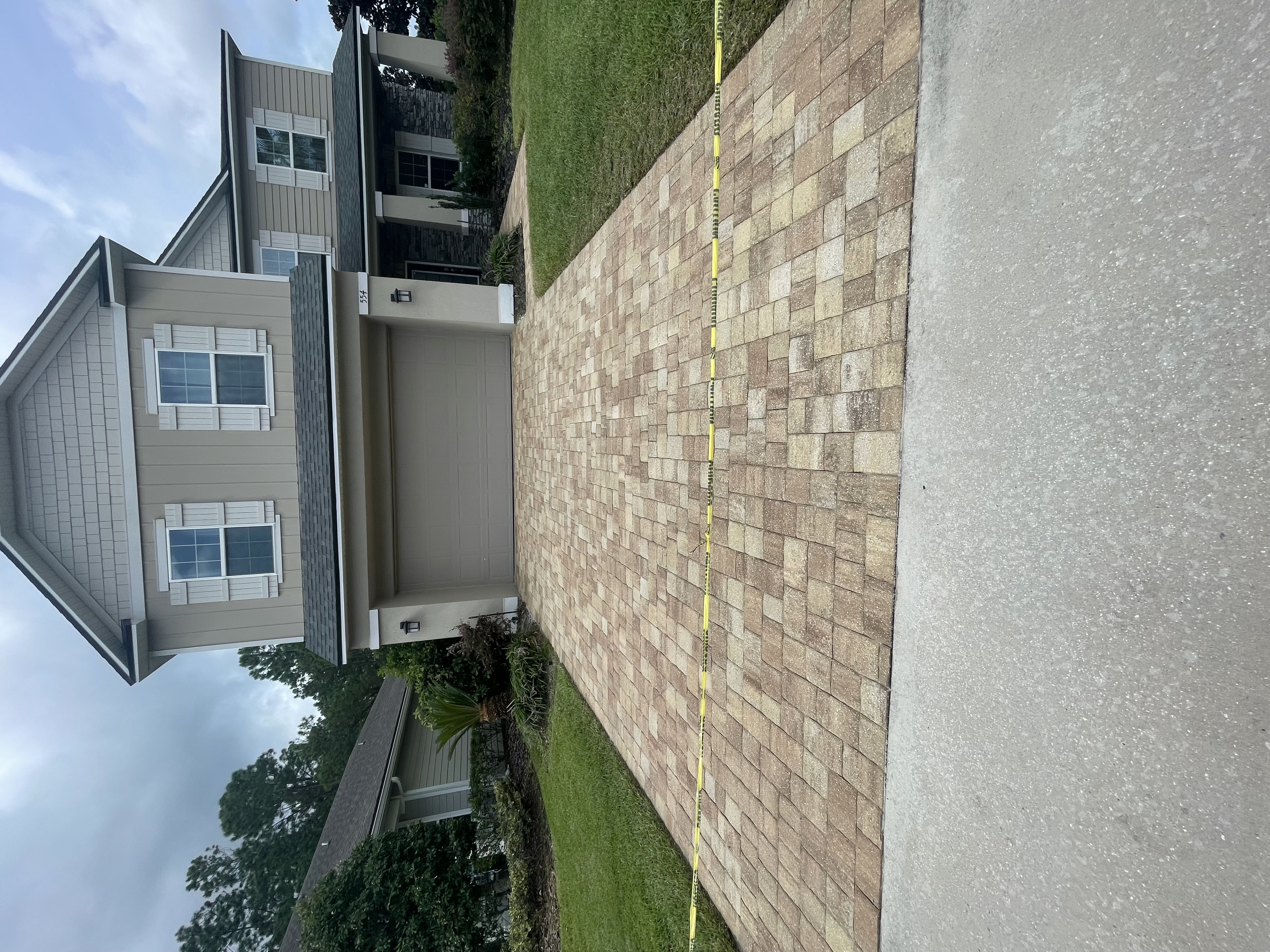 Restored paver patio after sealing by The Stream Team