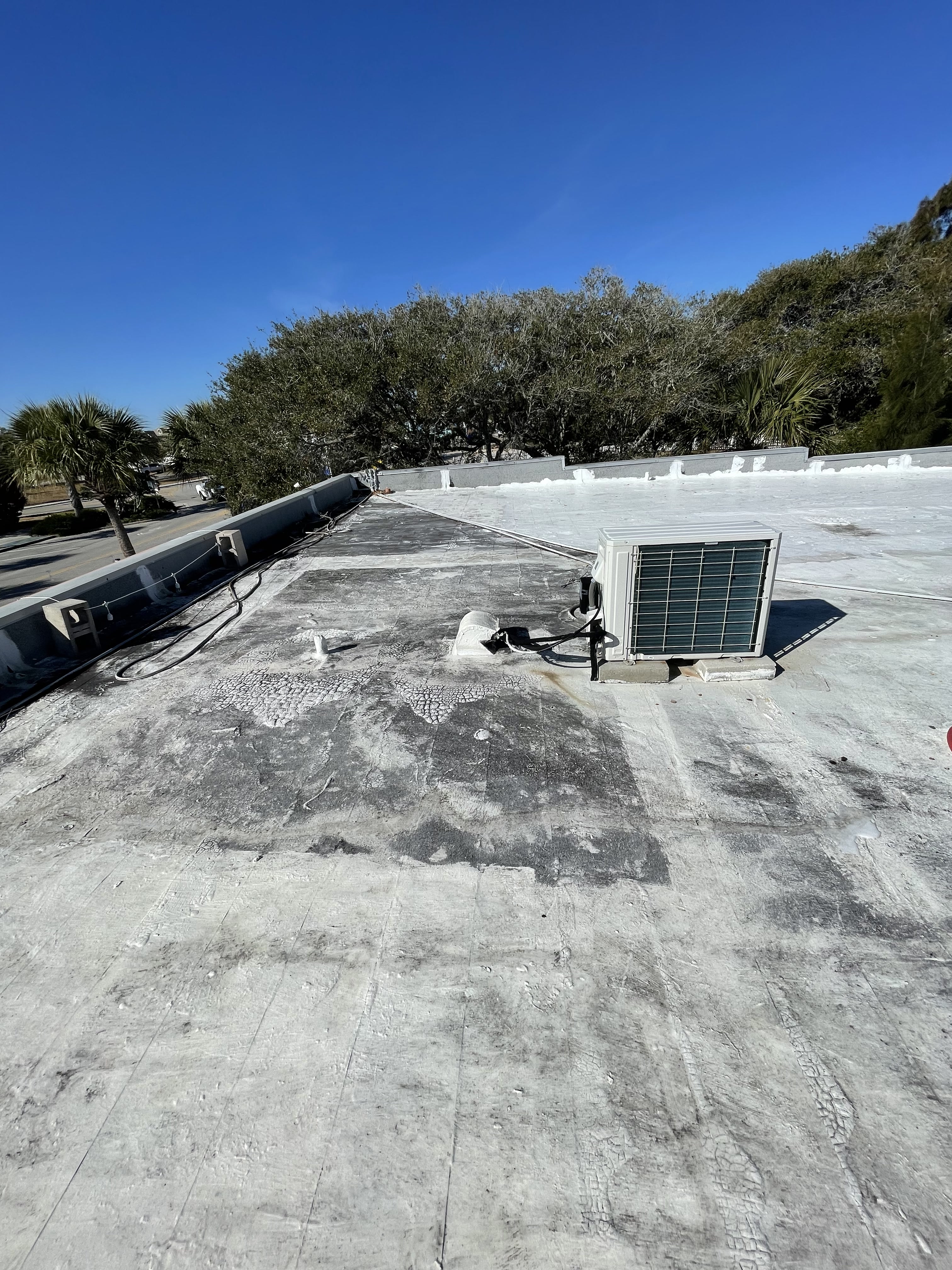 Commercial TPO roof before cleaning